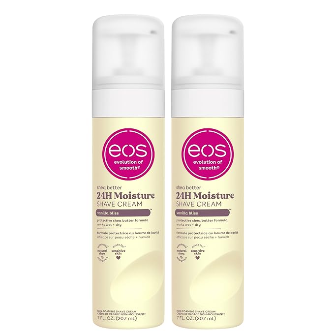 A pair of eos Shea Better 24H Moisture Shave Cream bottles in Vanilla Bliss scent, featuring a protective shea butter formula for wet and dry shaving. The bottles have a pump dispenser and a soft yellow design with a pink eos logo